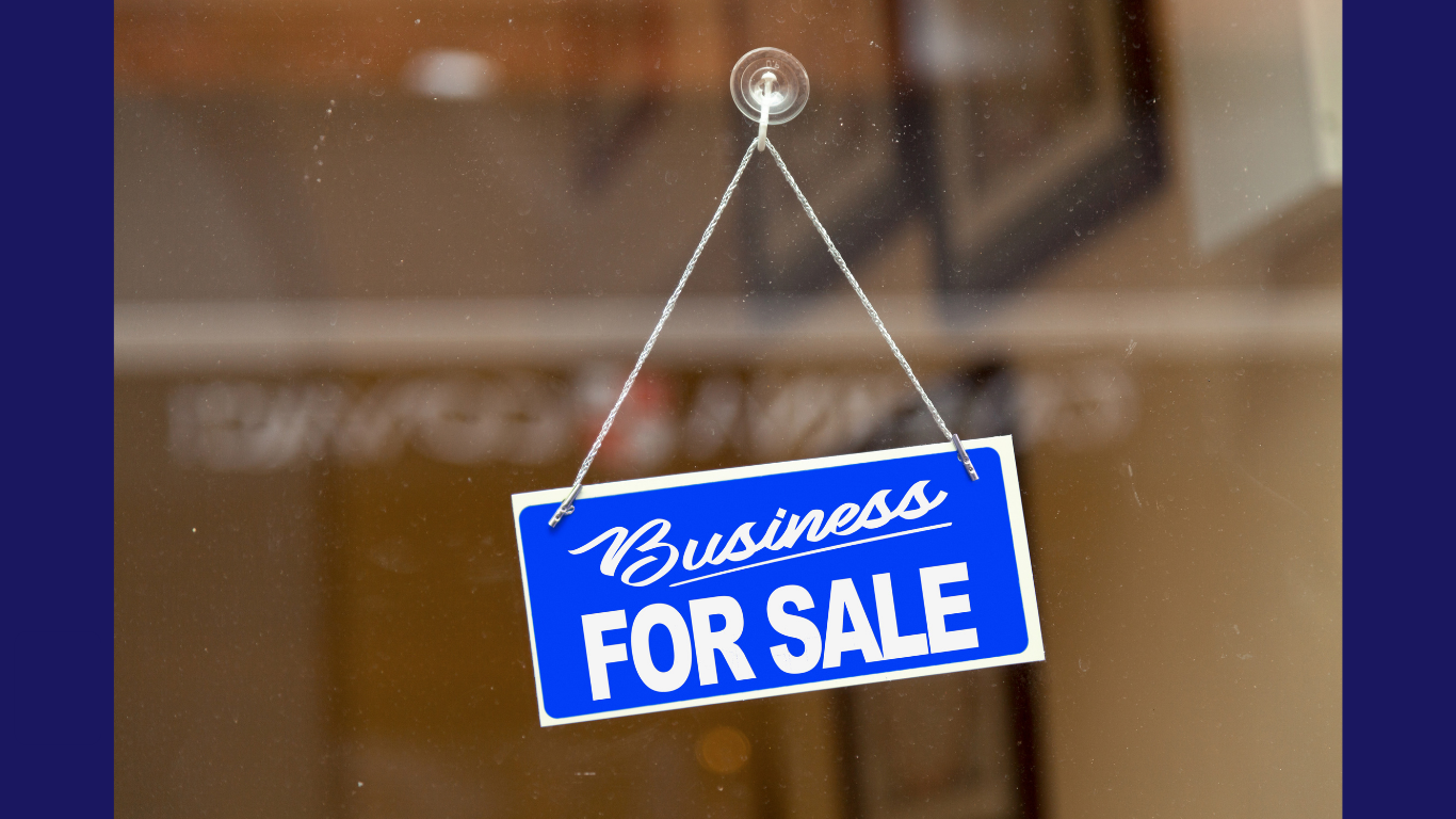 Business for sale sign hanging from a business' window