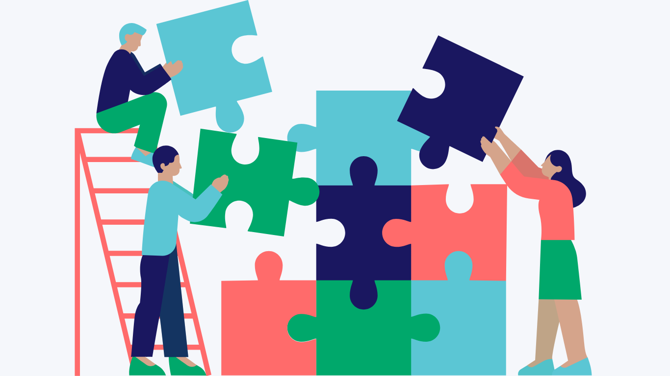 Three people working together to build a puzzle